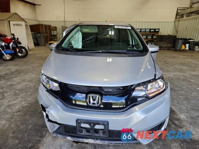 Piąte zdjęcie samochodu w środku: 2016 HONDA FIT LX VIN:JHMGK5H51GX003480 - miniatura