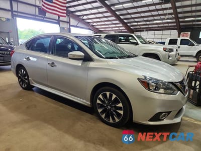 Czwarte zdjęcie samochodu z boku: 2016 NISSAN SENTRA SR VIN:3N1AB7AP5GY276972 - miniatura