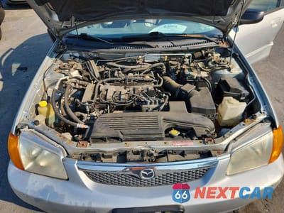 Zdjęcie 11 z 12 samochodu: 2000 MAZDA PROTEGE ES VIN:JM1BJ223XY0280045 - miniatura