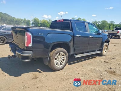 Trzecie zdjęcie samochodu z tyłu: 2016 GMC CANYON SLT VIN:1GTG6DE37G1349586 - miniatura