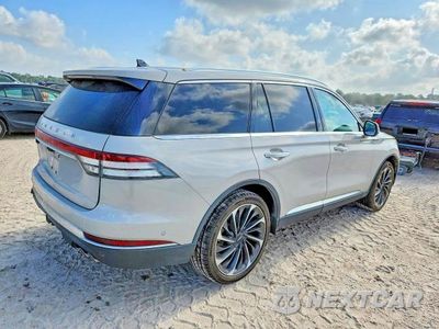 Trzecie zdjęcie samochodu z tyłu: 2021 LINCOLN AVIATOR RESERVE VIN:5LM5J7XC7MGL13838 - miniatura