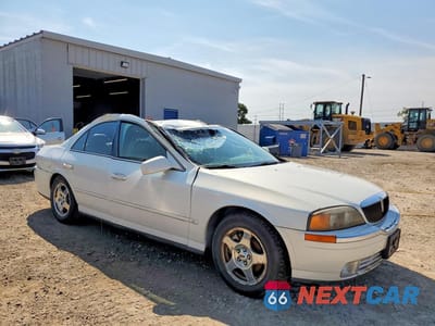 Czwarte zdjęcie samochodu z boku: 2000 LINCOLN LS VIN:1LNHM87A0YY782930 - miniatura