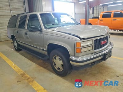 Czwarte zdjęcie samochodu z boku: 1999 GMC SUBURBAN K1500 VIN:3GKFK16R0XG514909 - miniatura