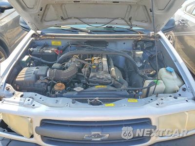 Zdjęcie 12 z 13 samochodu: 2000 CHEVROLET TRACKER VIN:2CNBJ13C4Y6942309 - miniatura
