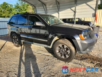 Czwarte zdjęcie samochodu z boku: 2010 JEEP GRAND CHEROKEE LAREDO VIN:1J4PS4GK2AC117953 - miniatura