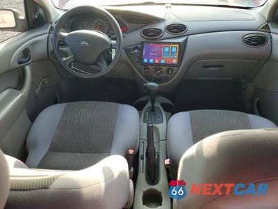 Zdjęcie 8 z 12 samochodu: 2004 FORD FOCUS LX VIN:1FAFP33P24W197357 - miniatura