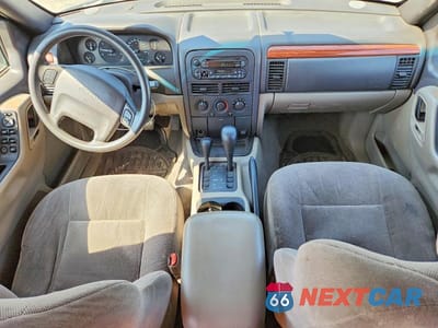 Zdjęcie 8 z 13 samochodu: 1999 JEEP GRAND CHEROKEE LAREDO VIN:1J4GW58S5XC687799 - miniatura