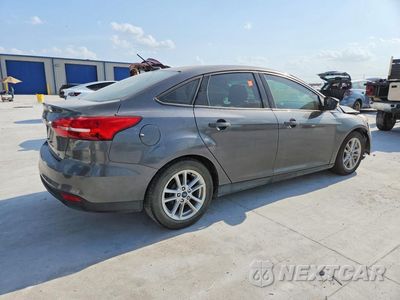 Trzecie zdjęcie samochodu z tyłu: 2017 FORD FOCUS SE VIN:1FADP3F27HL342231 - miniatura