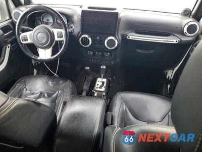 Zdjęcie 8 z 13 samochodu: 2014 JEEP WRANGLER UNLIMITED SAHARA VIN:1C4HJWEG8EL182450 - miniatura