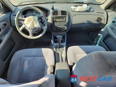 Zdjęcie 8 z 12 samochodu: 1999 MAZDA PROTEGE DX VIN:JM1BJ2228X0132384 - miniatura