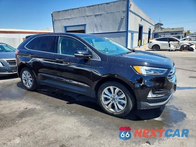 Czwarte zdjęcie samochodu z boku: 2022 FORD EDGE TITANIUM VIN:2FMPK4K98NBB04961 - miniatura