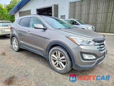 Czwarte zdjęcie samochodu z boku: 2014 HYUNDAI SANTA FE SPORT 2.0T VIN:5XYZWDLA2EG219187 - miniatura