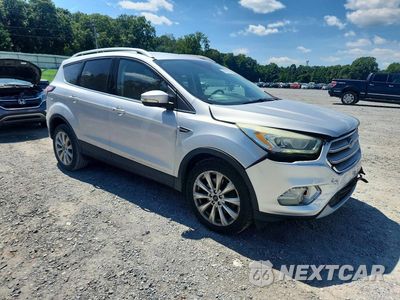 Czwarte zdjęcie samochodu z boku: 2017 FORD ESCAPE TITANIUM VIN:1FMCU9JD9HUC83389 - miniatura