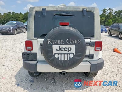 Zdjęcie 6 z 13 samochodu: 2010 JEEP WRANGLER UNLIMITED SAHARA VIN:1J4HA5H17AL221373 - miniatura