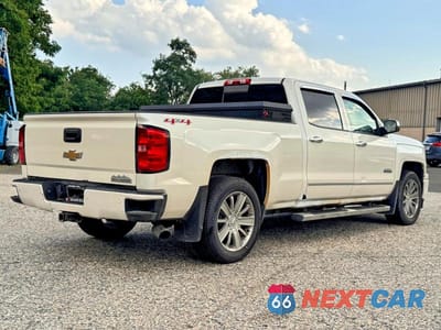 Czwarte zdjęcie samochodu z boku: 2014 CHEVROLET SILVERADO K1500 HIGH COUNTRY VIN:3GCUKTEC9EG328410 - miniatura