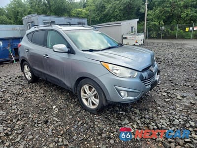 Czwarte zdjęcie samochodu z boku: 2013 HYUNDAI TUCSON GLS VIN:KM8JU3AC5DU723386 - miniatura