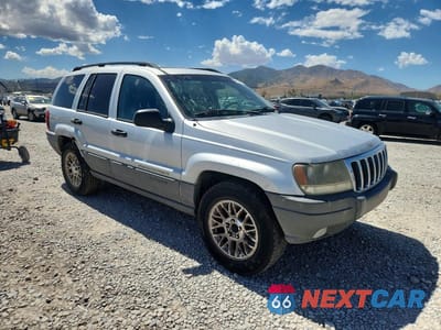 Czwarte zdjęcie samochodu z boku: 2002 JEEP GRAND CHEROKEE LAREDO VIN:1J4GW48S72C249997 - miniatura