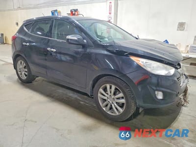Czwarte zdjęcie samochodu z boku: 2010 HYUNDAI TUCSON LIMITED VIN:KM8JUCAC4AU085336 - miniatura