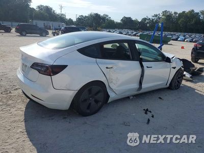 Trzecie zdjęcie samochodu z tyłu: 2023 TESLA MODEL 3 VIN:5YJ3E1EA7PF568957 - miniatura