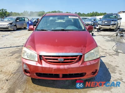 Piąte zdjęcie samochodu w środku: 2005 KIA SPECTRA LX VIN:KNAFE121555170773 - miniatura