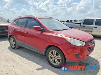Czwarte zdjęcie samochodu z boku: 2011 HYUNDAI TUCSON GLS VIN:KM8JU3AC4BU229176 - miniatura
