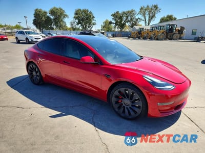 Czwarte zdjęcie samochodu z boku: 2023 TESLA MODEL 3 VIN:5YJ3E1EC5PF461178 - miniatura
