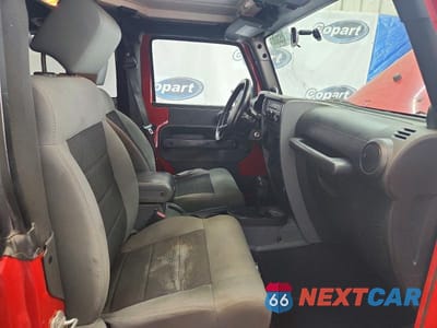 Zdjęcie 7 z 13 samochodu: 2010 JEEP WRANGLER VIN:1J4AA2D17AL136183 - miniatura