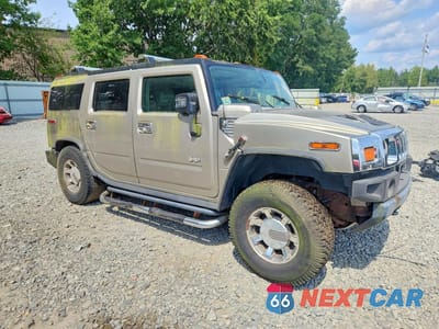Czwarte zdjęcie samochodu z boku: 2004 HUMMER H2 VIN:5GRGN23U64H117419 - miniatura