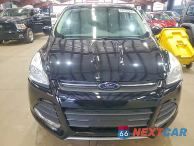 Piąte zdjęcie samochodu w środku: 2016 FORD ESCAPE SE VIN:1FMCU9GX6GUA34208 - miniatura
