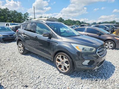 Czwarte zdjęcie samochodu z boku: 2017 FORD ESCAPE TITANIUM VIN:1FMCU0J96HUD12676 - miniatura