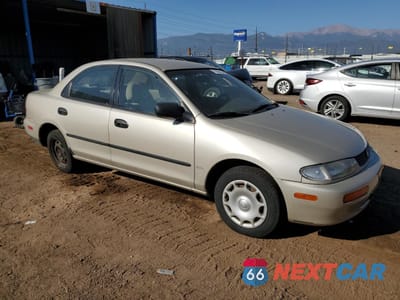 Czwarte zdjęcie samochodu z boku: 1996 MAZDA PROTEGE LX VIN:JM1BB1426T0328645 - miniatura
