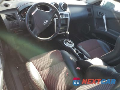Zdjęcie 8 z 12 samochodu: 2005 HYUNDAI TIBURON GT VIN:KMHHN65F45U174430 - miniatura