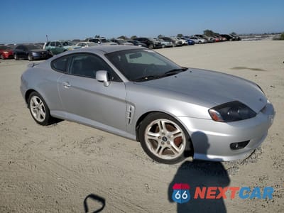 Czwarte zdjęcie samochodu z boku: 2005 HYUNDAI TIBURON GT VIN:KMHHN65F45U174430 - miniatura