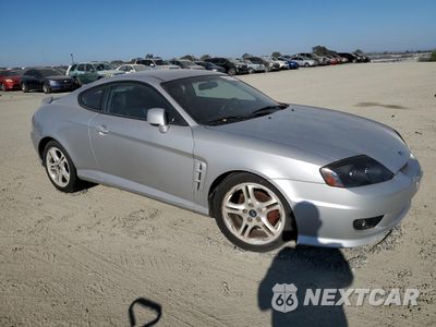 Czwarte zdjęcie samochodu z boku: 2005 HYUNDAI TIBURON GT VIN:KMHHN65F45U174430 - miniatura