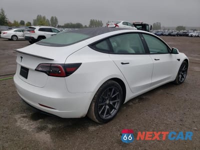 Trzecie zdjęcie samochodu z tyłu: 2021 TESLA MODEL 3 VIN:5YJ3E1EA0MF861885 - miniatura