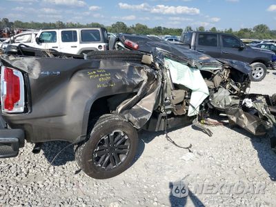 Trzecie zdjęcie samochodu z tyłu: 2015 GMC CANYON SLT VIN:1GTG6CE31F1115873 - miniatura
