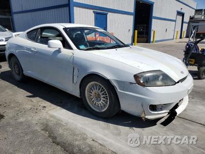 Czwarte zdjęcie samochodu z boku: 2005 HYUNDAI TIBURON VIN:KMHHN65F25U168299 - miniatura