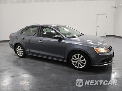 Czwarte zdjęcie samochodu z boku: 2015 VOLKSWAGEN JETTA SE VIN:3VWD17AJ3FM257980 - miniatura