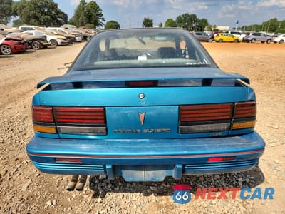 Zdjęcie 6 z 14 samochodu: 1994 PONTIAC SUNBIRD LE VIN:1G2JB14T4R7546107 - miniatura