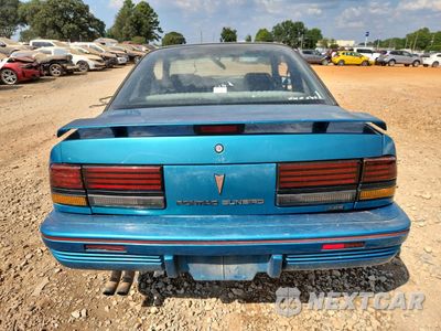 Zdjęcie 6 z 14 samochodu: 1994 PONTIAC SUNBIRD LE VIN:1G2JB14T4R7546107 - miniatura