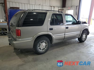 Trzecie zdjęcie samochodu z tyłu: 1999 GMC JIMMY VIN:1GKDT13W6X2514954 - miniatura