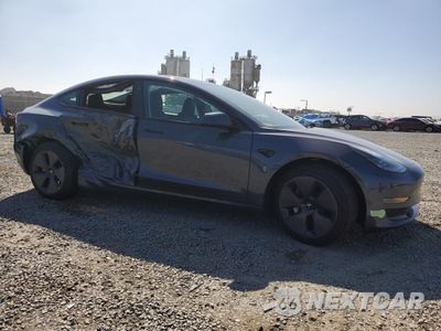 Czwarte zdjęcie samochodu z boku: 2023 TESLA MODEL 3 VIN:5YJ3E1EA8PF588800 - miniatura