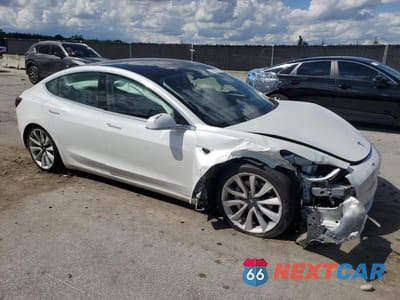 Czwarte zdjęcie samochodu z boku: 2020 TESLA MODEL 3 VIN:5YJ3E1EA1LF797564 - miniatura