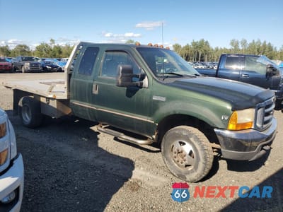 Czwarte zdjęcie samochodu z boku: 1999 FORD F350 SUPER DUTY VIN:1FTWX33F3XEA32140 - miniatura