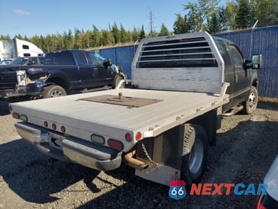 Trzecie zdjęcie samochodu z tyłu: 1999 FORD F350 SUPER DUTY VIN:1FTWX33F3XEA32140 - miniatura