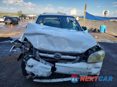 Piąte zdjęcie samochodu w środku: 2002 MAZDA TRIBUTE LX VIN:4F2YU09102KM51326 - miniatura