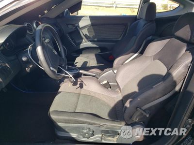 Zdjęcie 7 z 14 samochodu: 2005 HYUNDAI TIBURON VIN:KMHHM65D65U178514 - miniatura