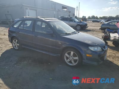Czwarte zdjęcie samochodu z boku: 2002 MAZDA PROTEGE PR5 VIN:JM1BJ246221612181 - miniatura