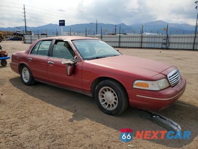 Czwarte zdjęcie samochodu z boku: 2000 FORD CROWN VICTORIA LX VIN:2FAFP74W4YX100974 - miniatura