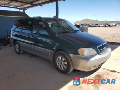 Czwarte zdjęcie samochodu z boku: 2005 KIA SEDONA EX VIN:KNDUP132856742554 - miniatura